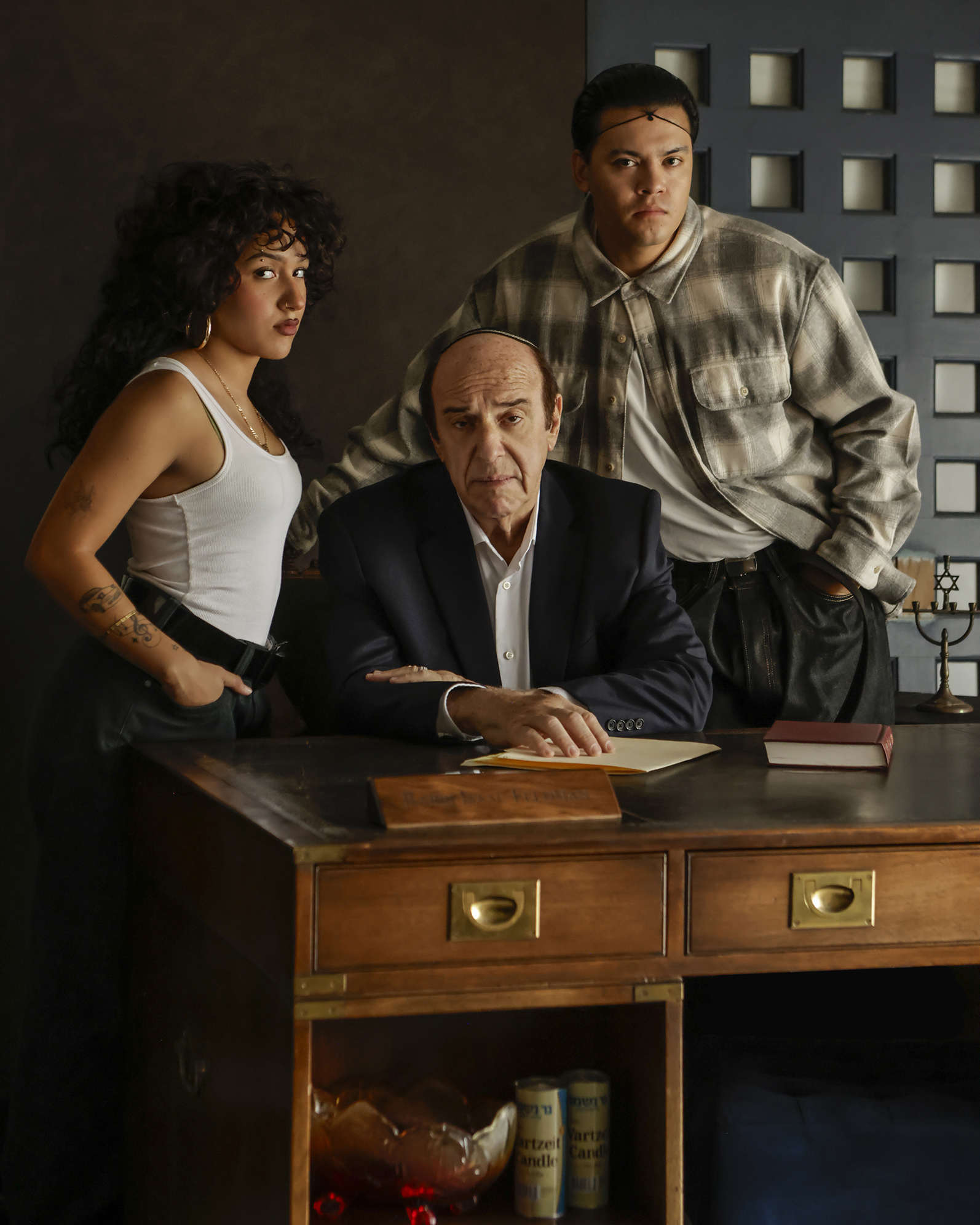 09-29-26_SorchaAugustine_094153-FINAL Three actors pose around a wooden desk during a scene from Kaddish for the Barrio.